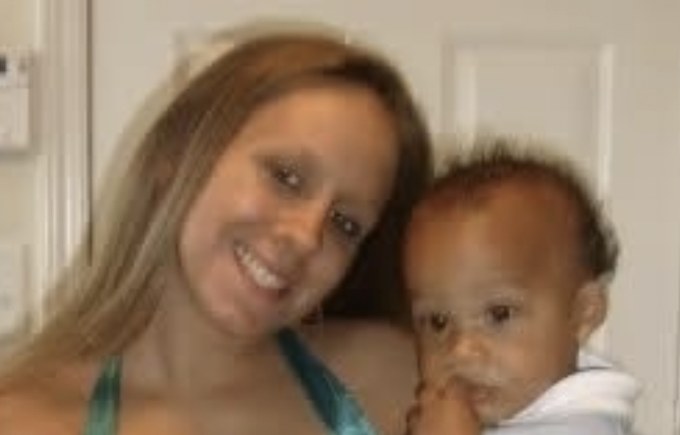 Steph as a teenage mom, holding her baby son